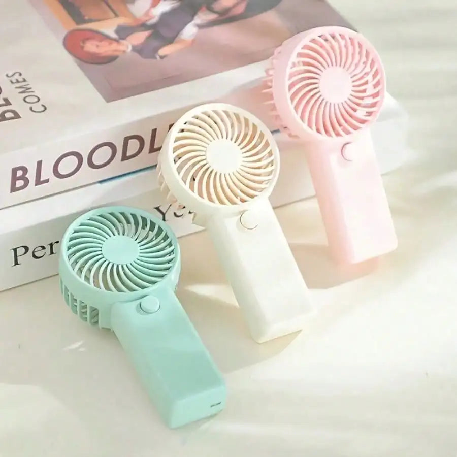 Mini ventilador de mano, portátil, ligero, alimentado por batería, con funcionamiento silencioso de alta velocidad, 4 colores, 1 ud.